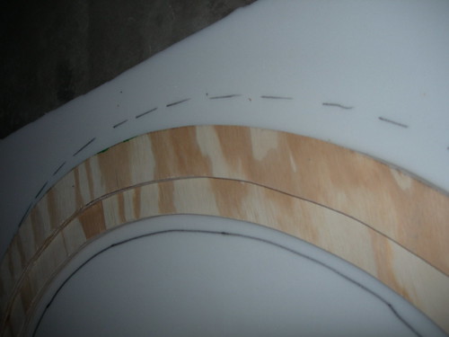 Plywood rail template on foam while marking padding for a vinyl-wrapped poker rail